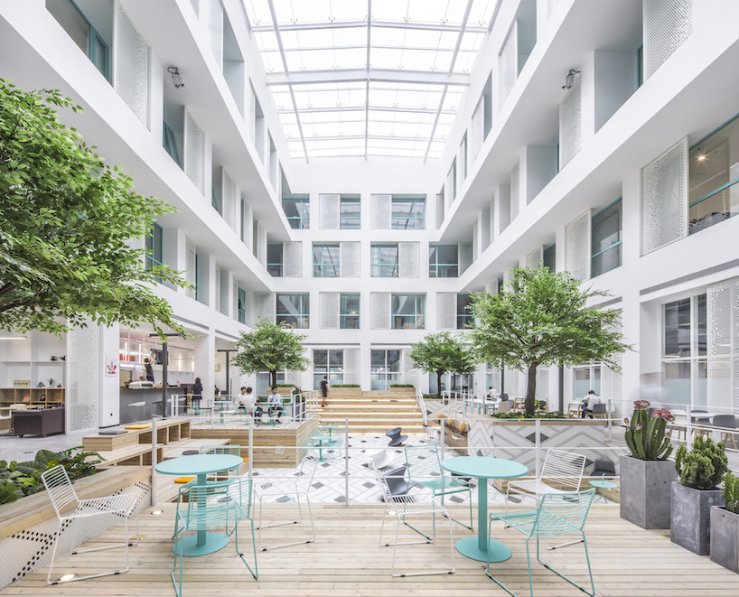 MAT office's beijing apartment complex and co-working space features a 16 meter-high atrium