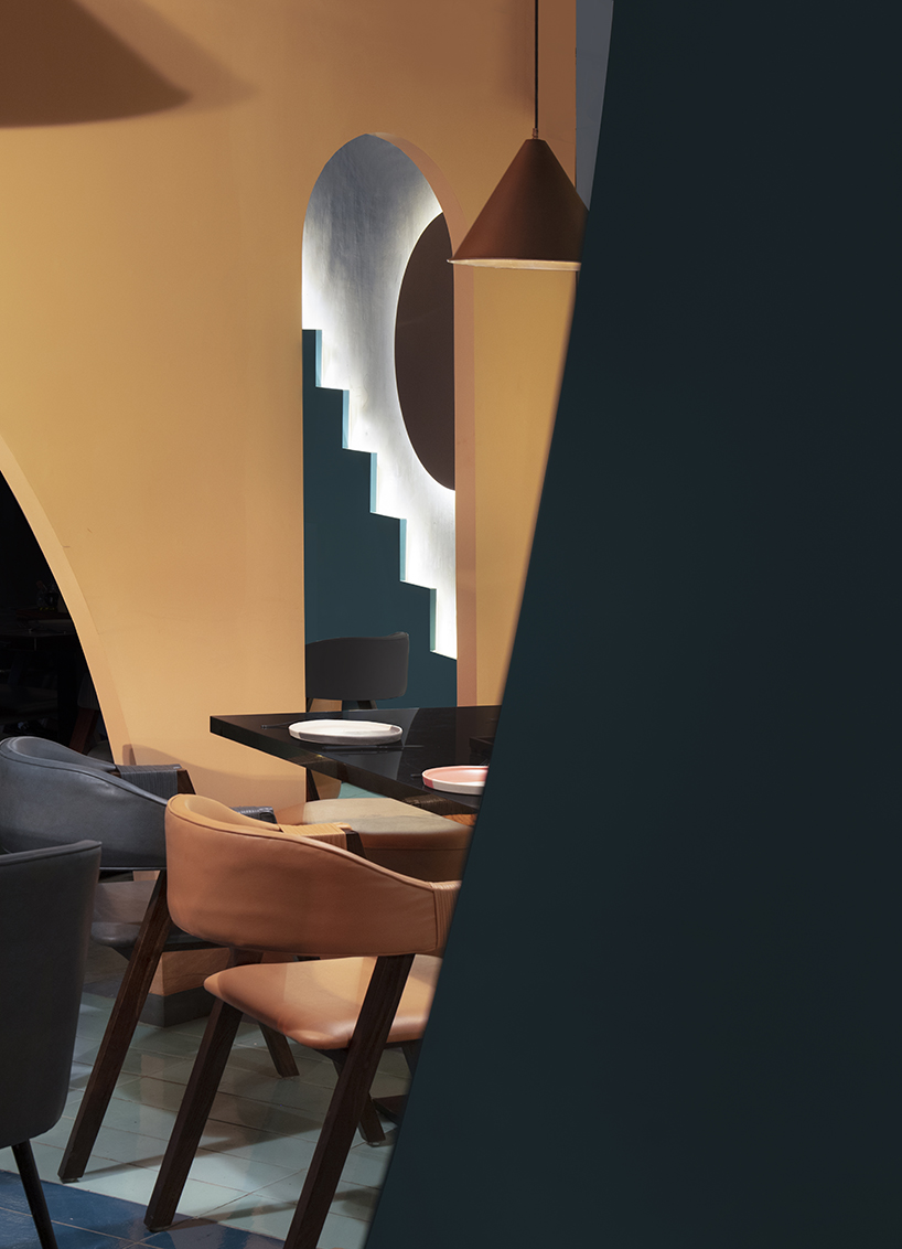 brightly colored volumes shape indian restaurant by RENESA