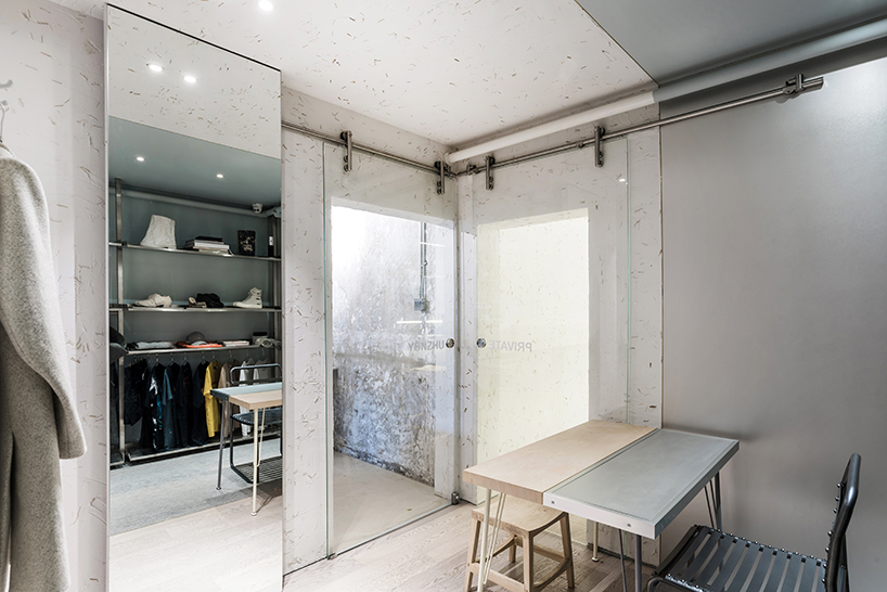 JANG company divides a beijing design studio into wood + steel