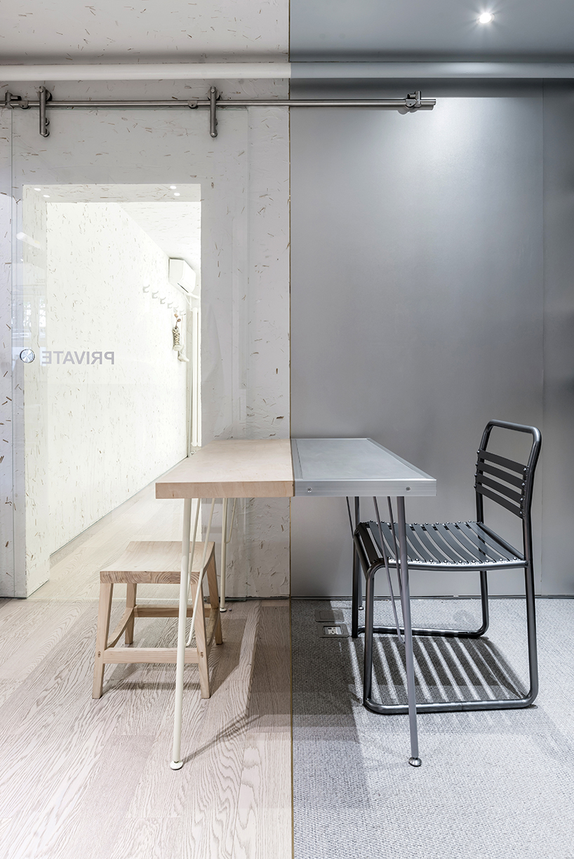 JANG company divides a beijing design studio into wood + steel