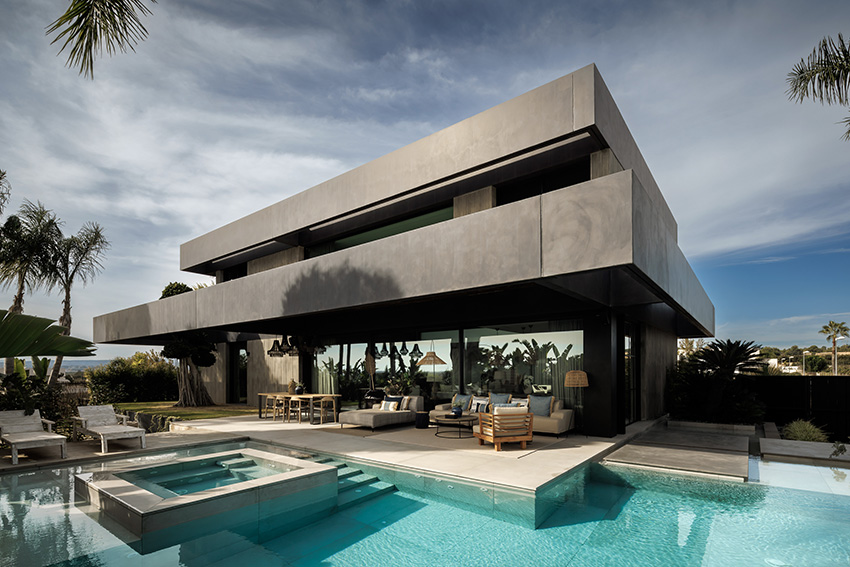 ascoz arquitectura engulfs residence 321 in exotic greenery for asian-inspired oasis in valencian hillside