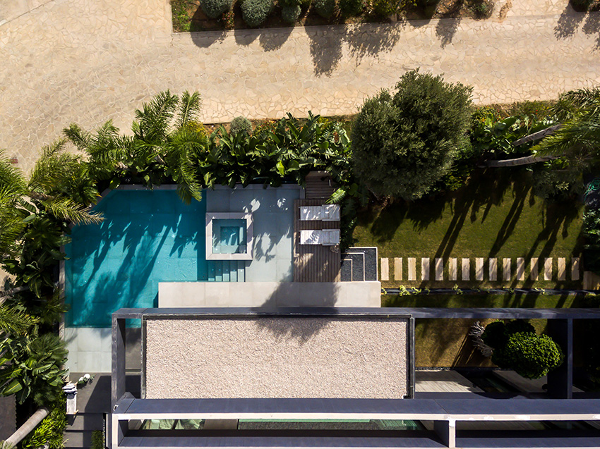 ascoz arquitectura engulfs residence 321 in exotic greenery for asian-inspired oasis in valencian hillside