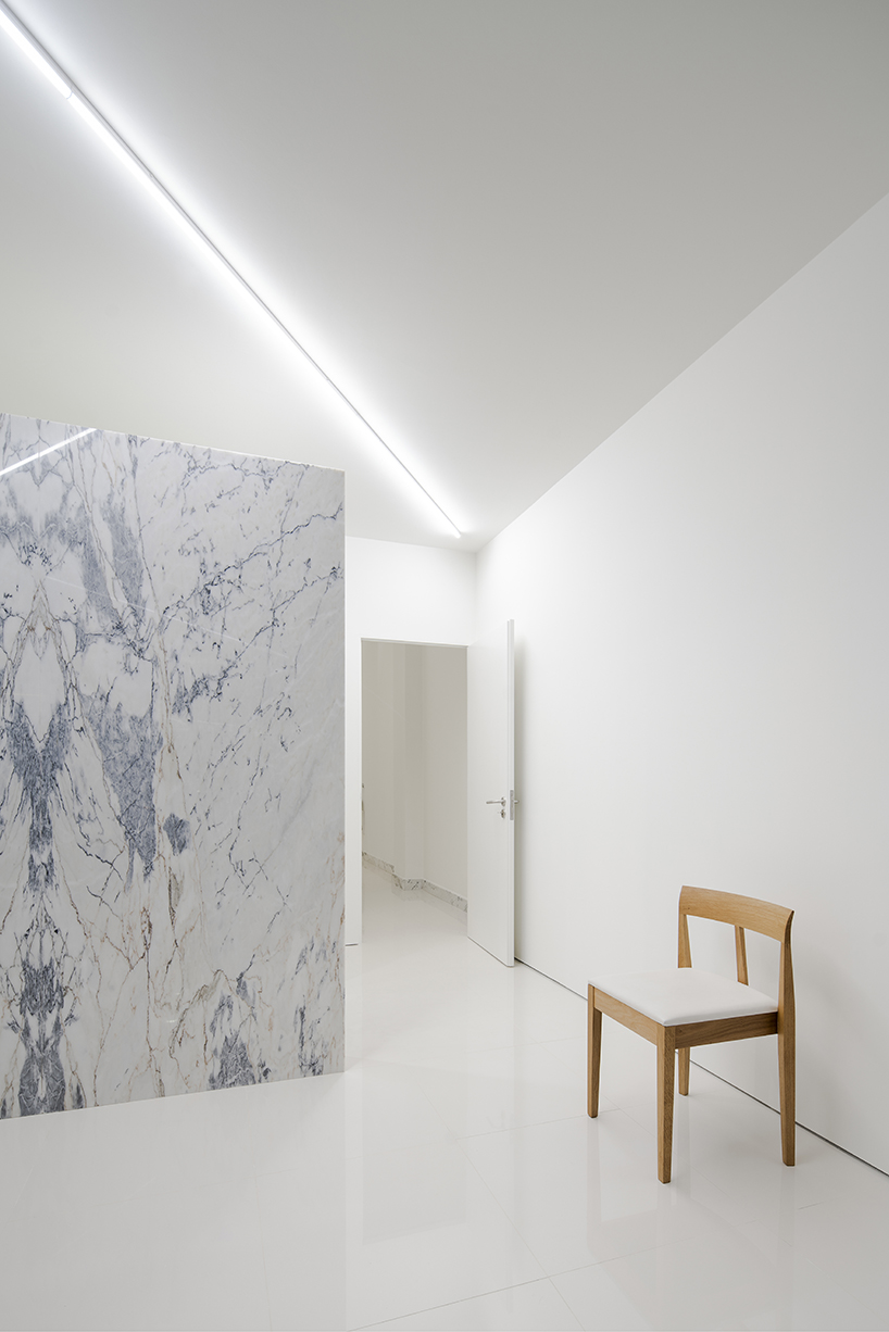 subtle marble lines define the layout of this medical center in braga, by martins architecture