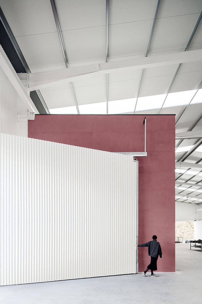 martins architecture office constructs large reflective warehouse in portugal