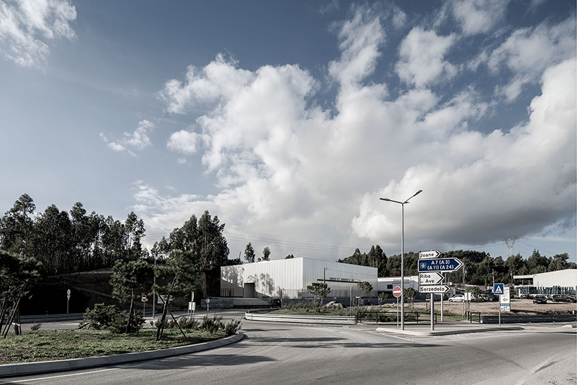 martins architecture office constructs large reflective warehouse in portugal