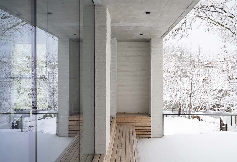 chado’s monolithic white concrete brick office stands near botanical garden in russia - 3