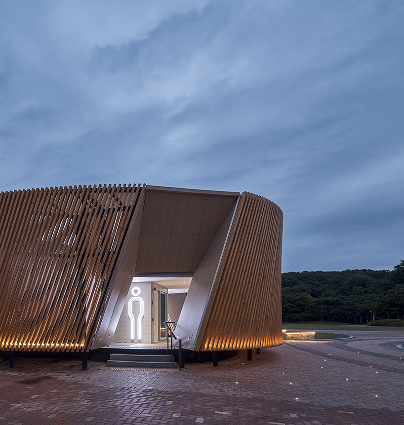 double-layer timber facade enfolds renovated public toilet in korea by daniel valle architects