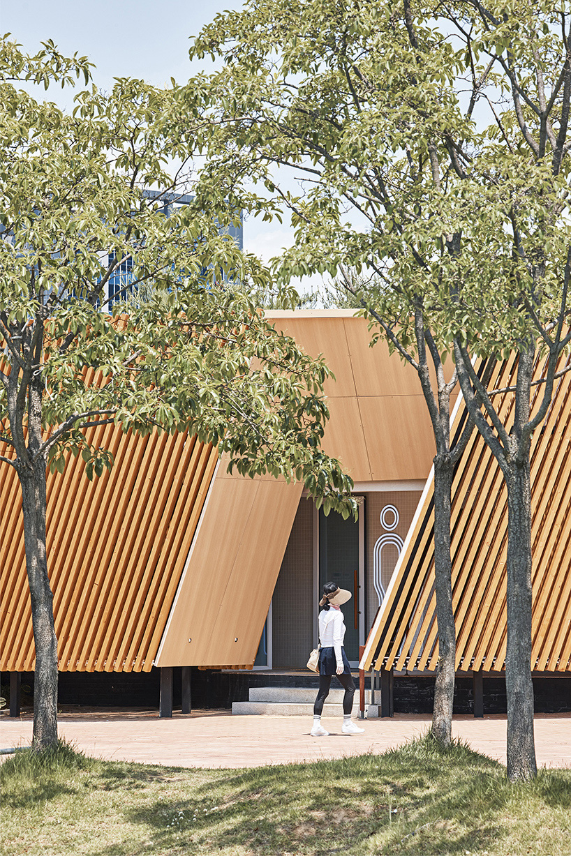 double-layer timber facade enfolds renovated public toilet in korea by daniel valle architects