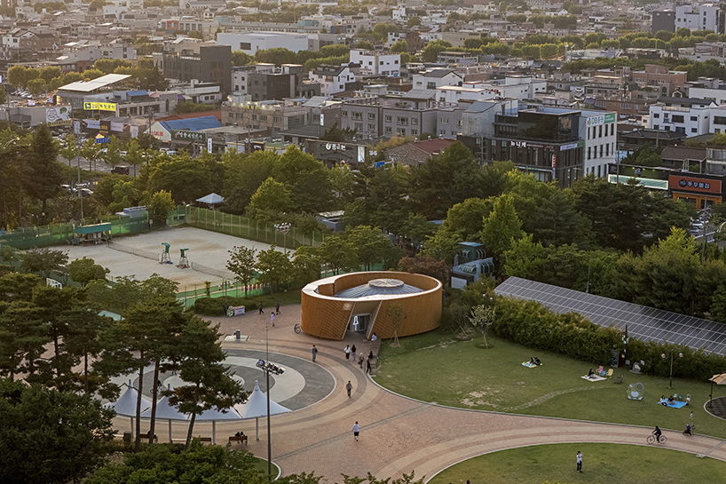 double-layer timber facade enfolds renovated public toilet in korea by daniel valle architects