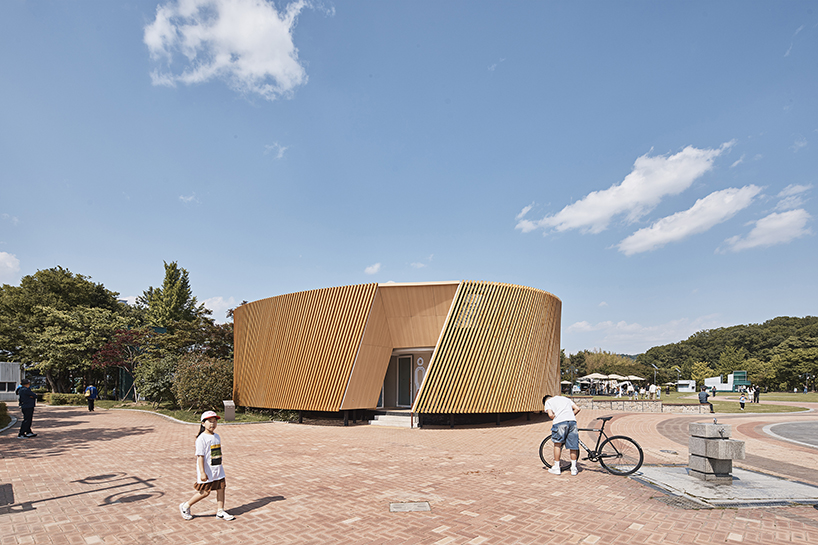 double-layer timber facade enfolds renovated public toilet in korea by daniel valle architects
