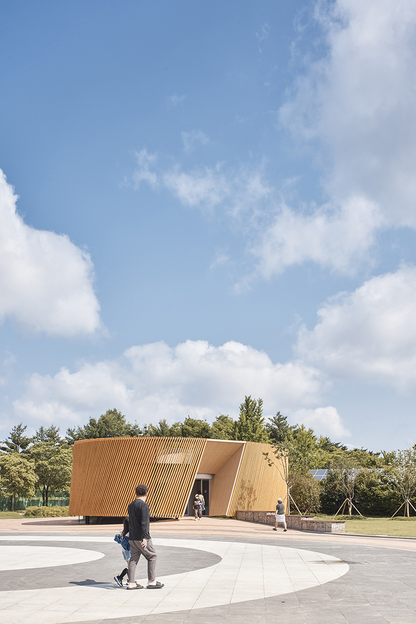 double-layer timber facade enfolds renovated public toilet in korea by daniel valle architects