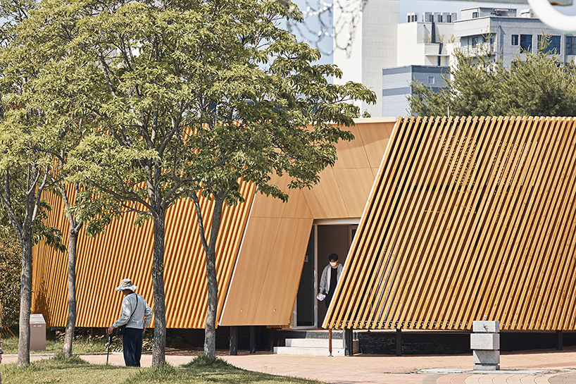 double-layer timber facade enfolds renovated public toilet in korea by daniel valle architects