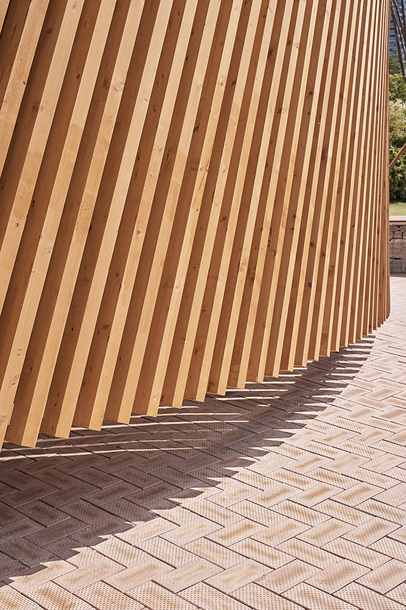 double-layer timber facade enfolds renovated public toilet in korea by daniel valle architects