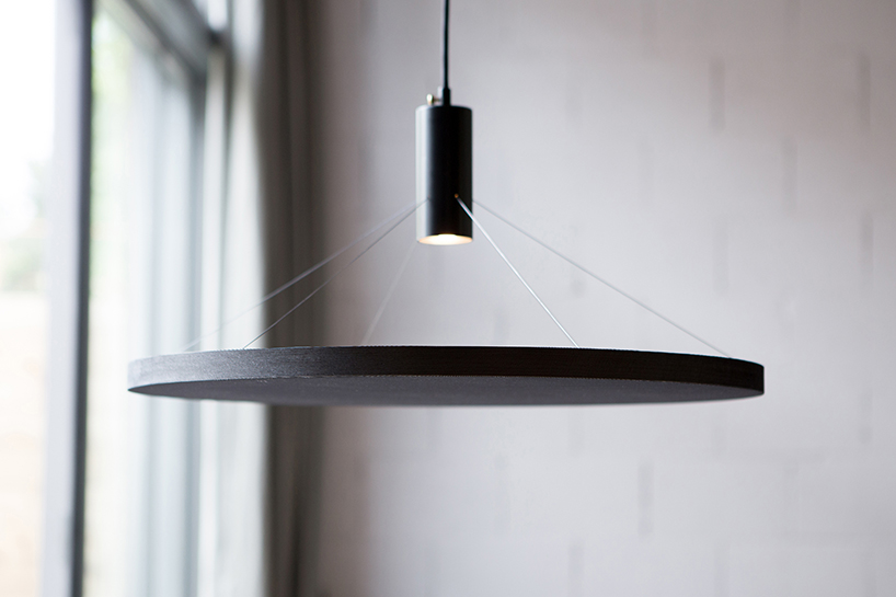 wood and fabric mingle in minimal floating light by spitsberg