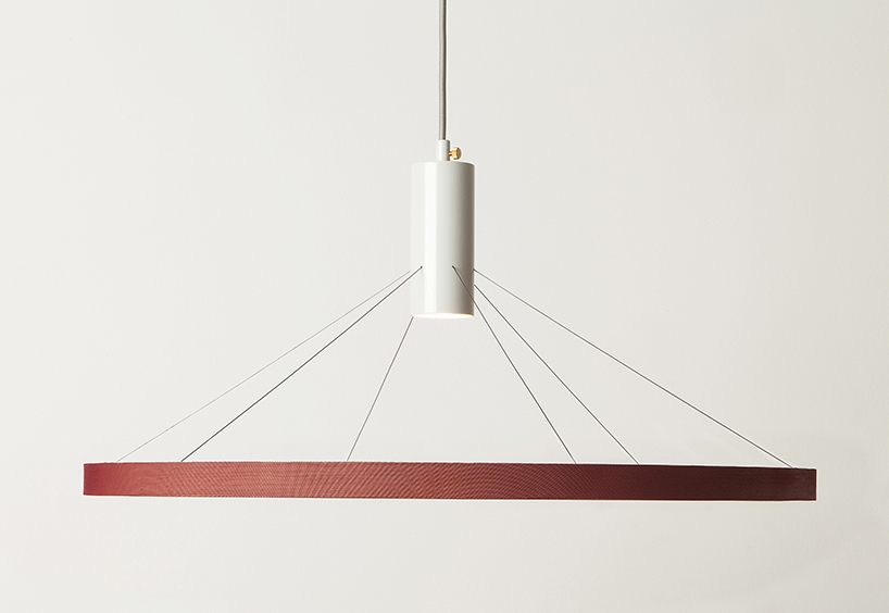 wood and fabric mingle in minimal floating light by spitsberg