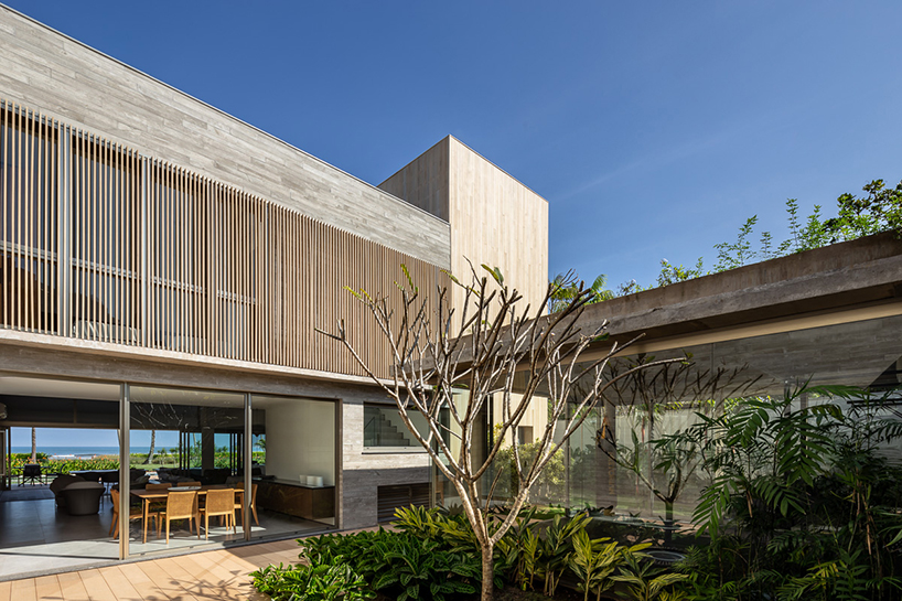 basiches arquitetos integrates outdoor spaces into MF house in são paulo