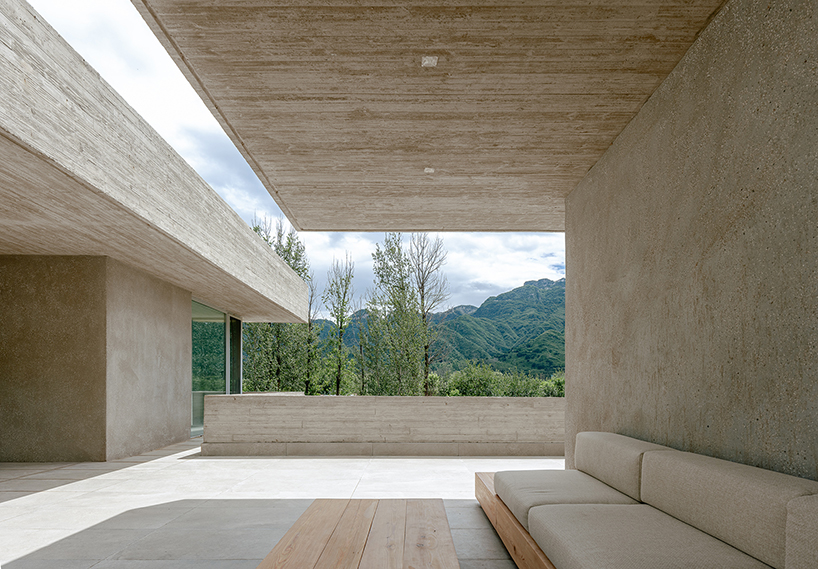 riverside house's geometric concrete volumes by xiān architects pop up in rural beijing
