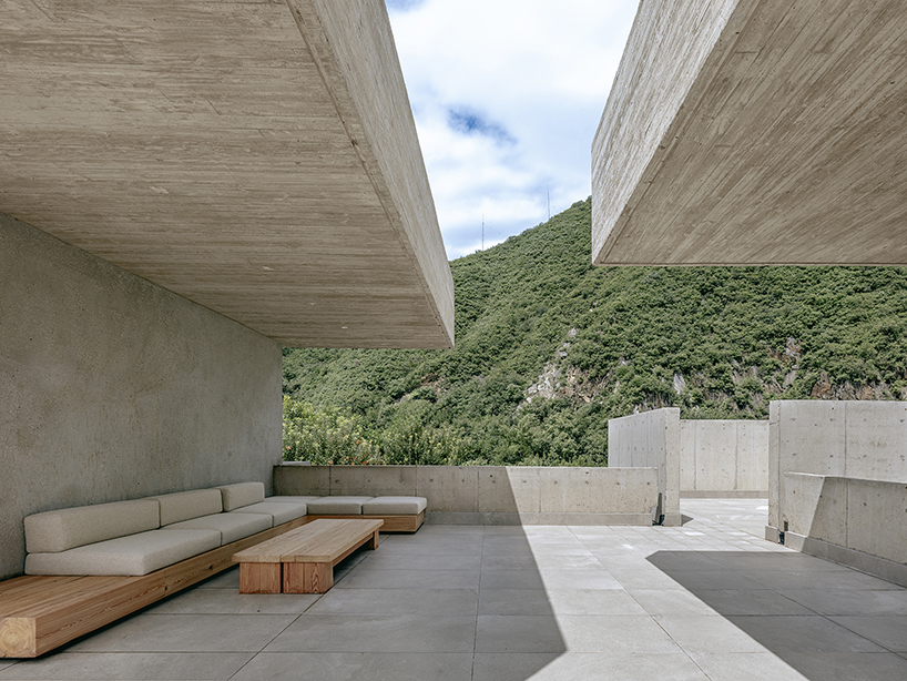 riverside house's geometric concrete volumes by xiān architects pop up in rural beijing