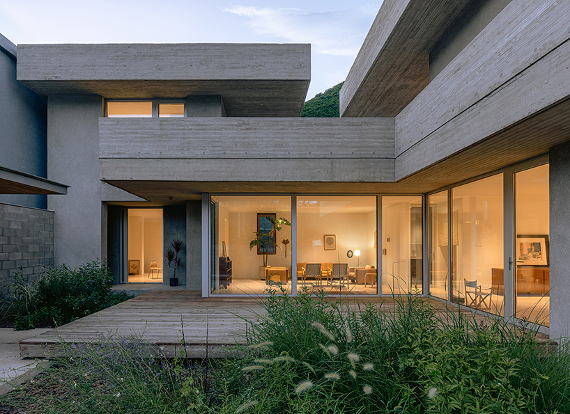 riverside house's geometric concrete volumes by xiān architects pop up in rural beijing