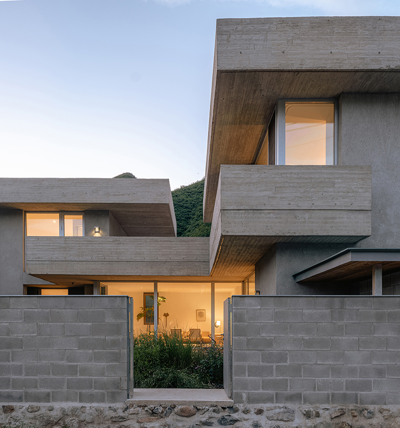 riverside house's geometric concrete volumes by xiān architects pop up in rural beijing