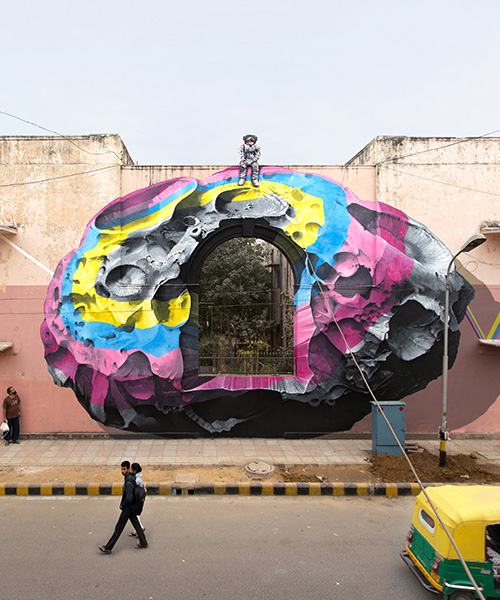nevercrew sits an astronaut on top of their new delhi street intervention