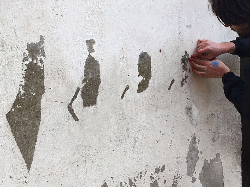 pejac peels paint off palestinian walls to compose evocative landscapes