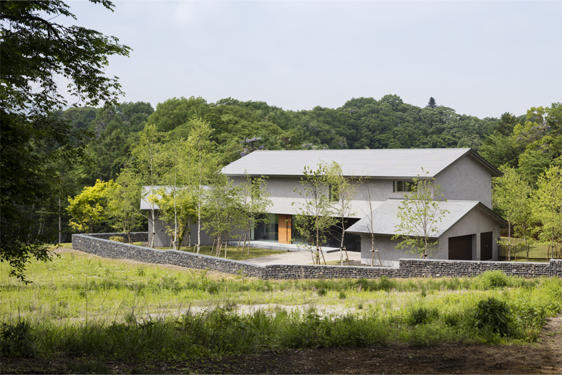 KIAS designs a cluster of concrete volumes for weekend house in japan designboom