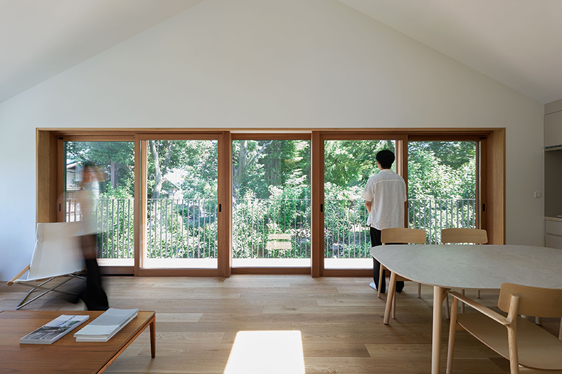 circular aperture welcomes natural light within gabled tokyo house by KIAS