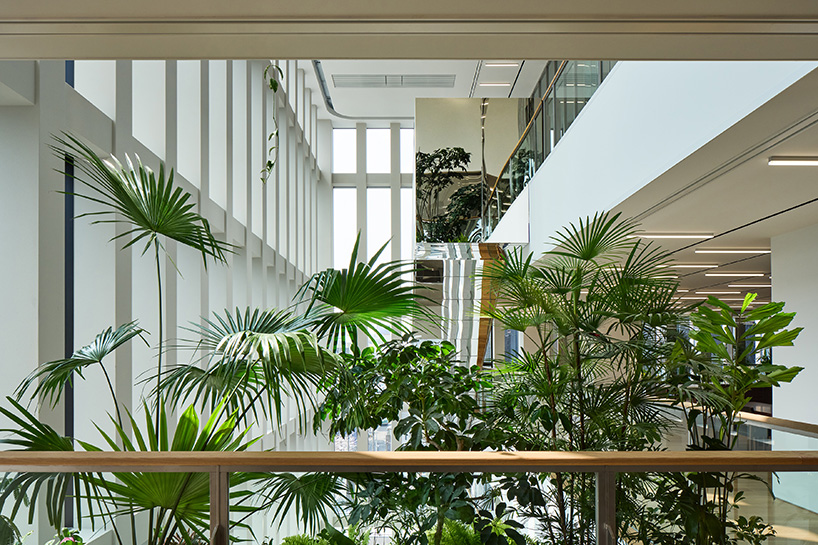 KIAS pairs textured brick facade with planted atrium for headquarters in japan - 11