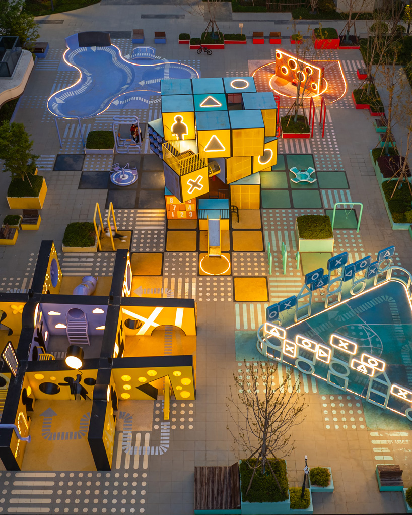 layered geometric rubix square by 100architects blends play installations with lighting