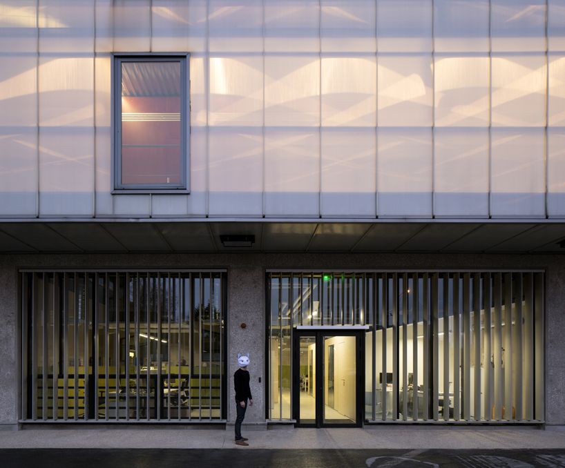FUSO cuts warehouse to create patios that let light flow through offices in paris