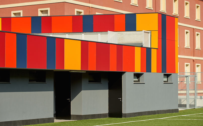 foraster's colorful rehabilitation swaps the standard cement aspects of a school in bilbao