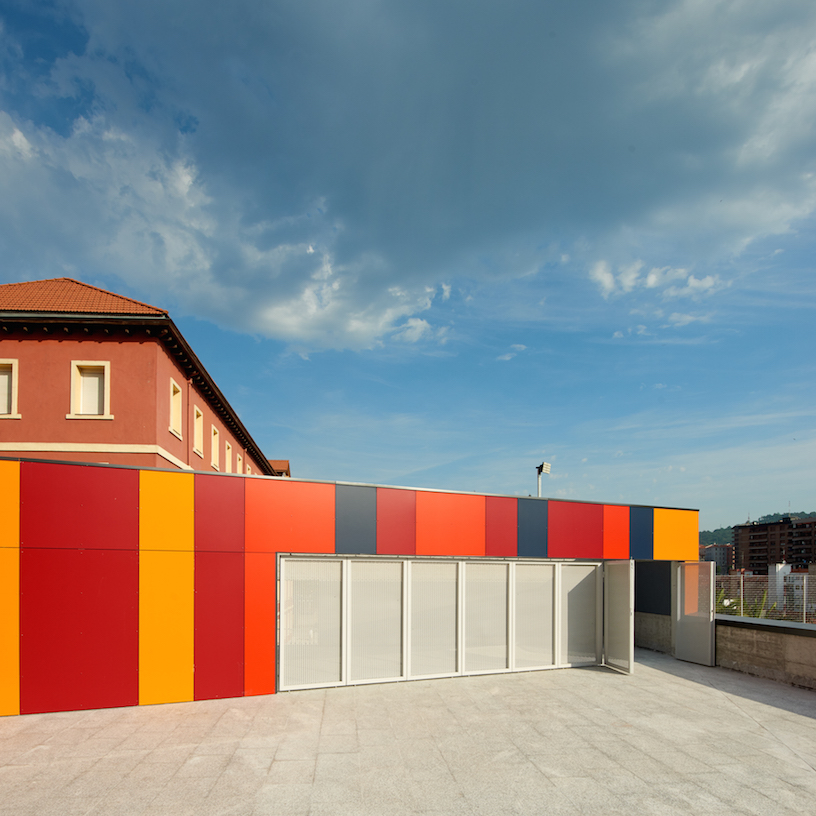 foraster's colorful rehabilitation swaps the standard cement aspects of a school in bilbao