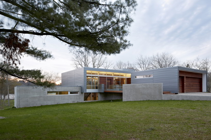 studio dwell architects designs intimate river view house in illinois