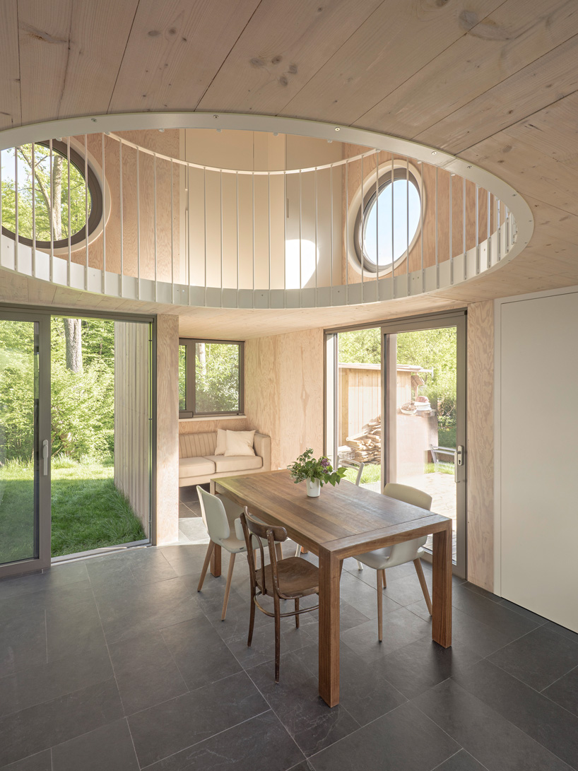 villa minimale in vienna comprises four identical wooden boxes in cross-plan configuration