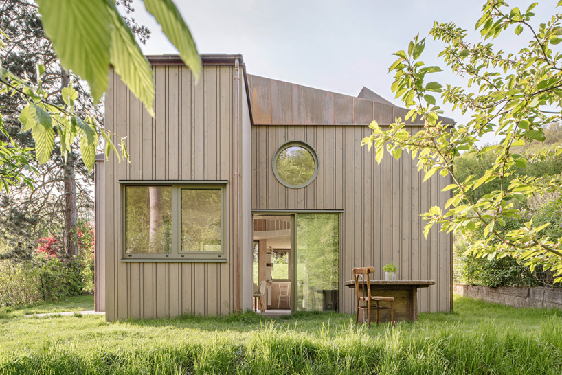 villa minimale in vienna comprises four identical wooden boxes in cross-plan configuration