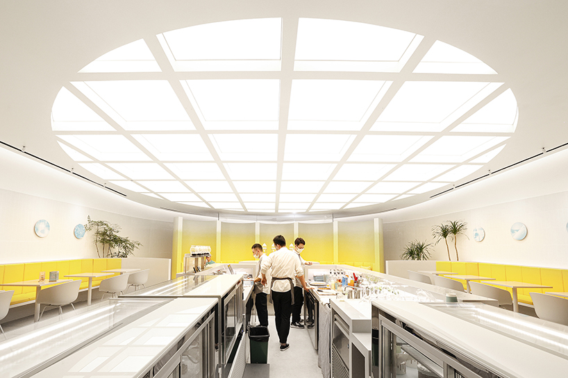 curved yellow walls define theatrical pastry shop interior by ramoprimo in beijing