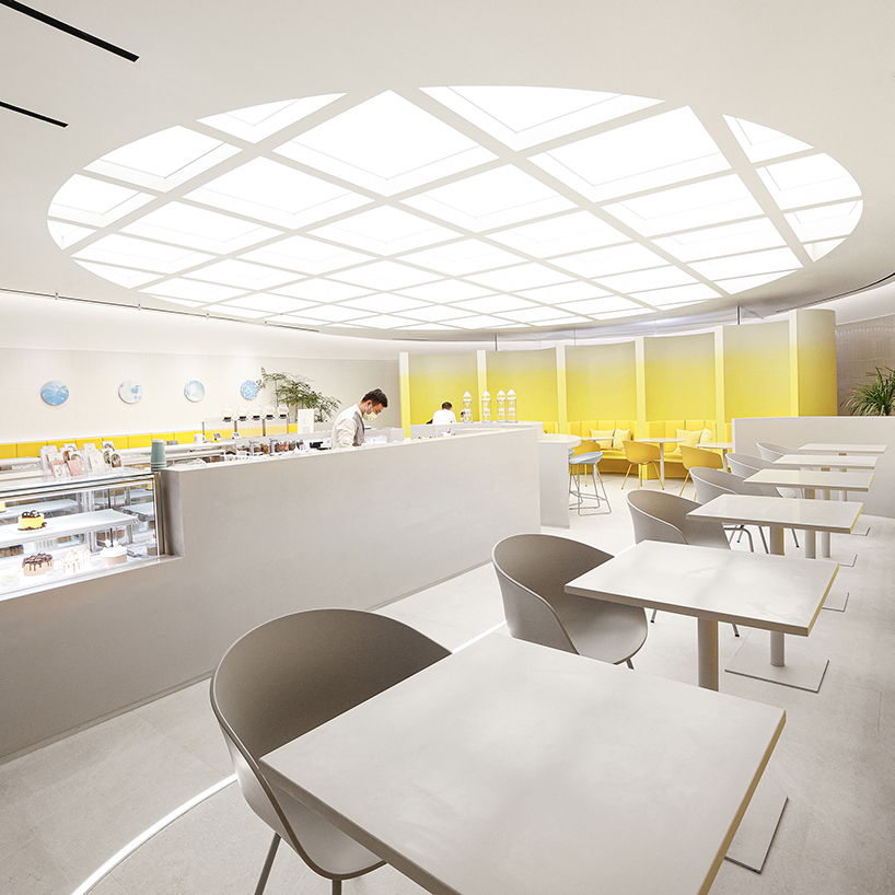 curved yellow walls define theatrical pastry shop interior by ramoprimo in beijing