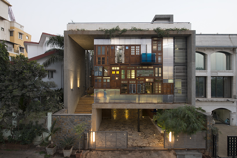 S+PSARCHITECTS adds recycled doors and windows to mumbai house façade