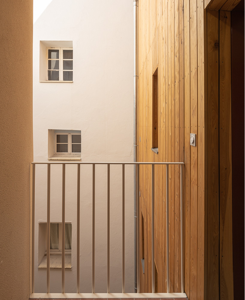 The mobile architecture office's wooden residential complex reinterprets the characteristic Parisian suburban architecture
