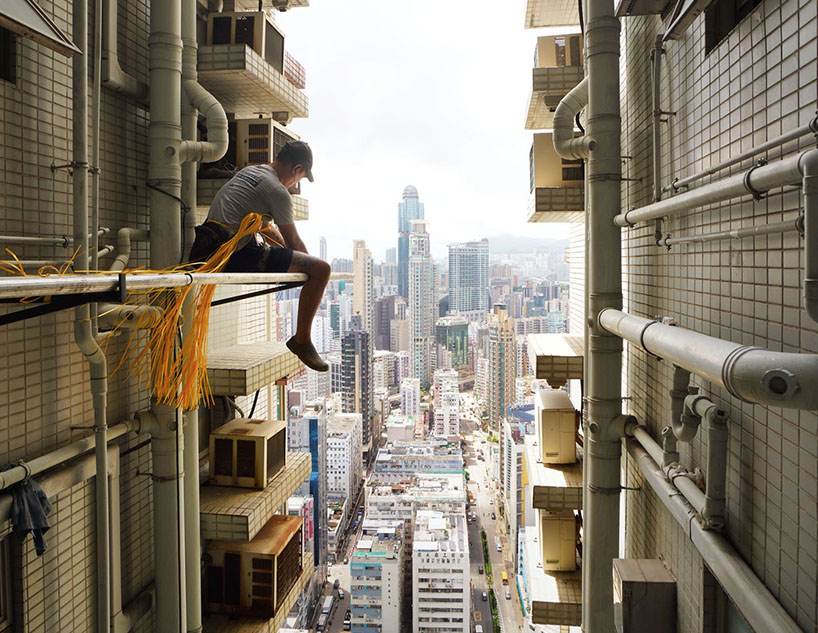 romain jacquet-lagrèze captures bamboo scaffolding workers hovering above hong kong