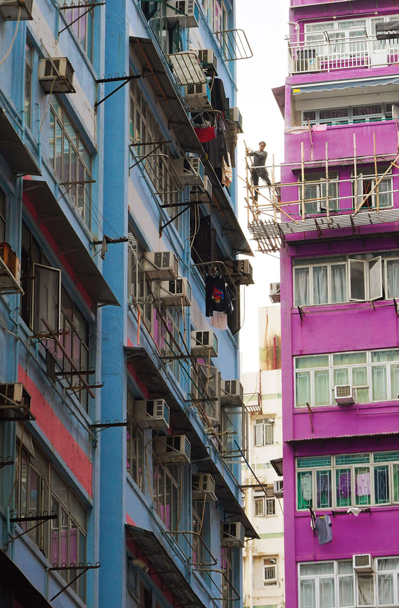 romain jacquet-lagrèze captures bamboo scaffolding workers hovering above hong kong