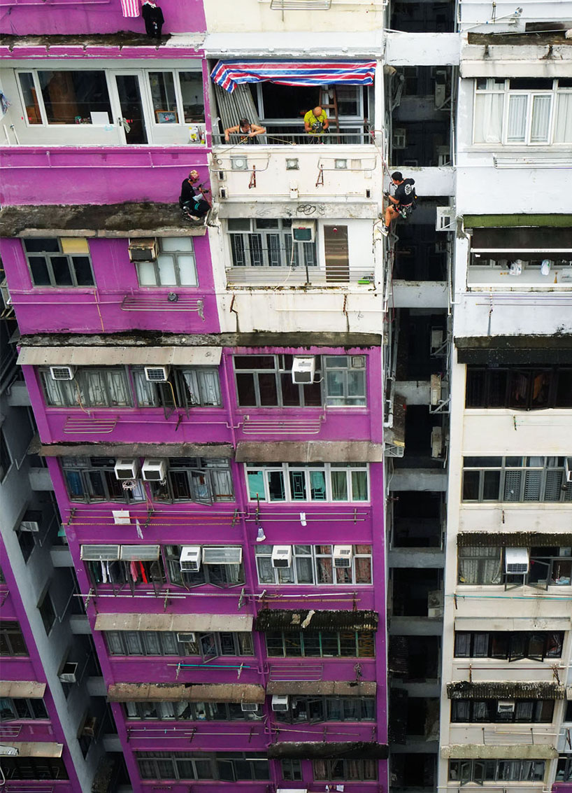 romain jacquet-lagrèze captures bamboo scaffolding workers hovering above hong kong