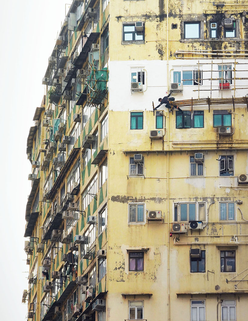 romain jacquet-lagrèze captures bamboo scaffolding workers hovering above hong kong