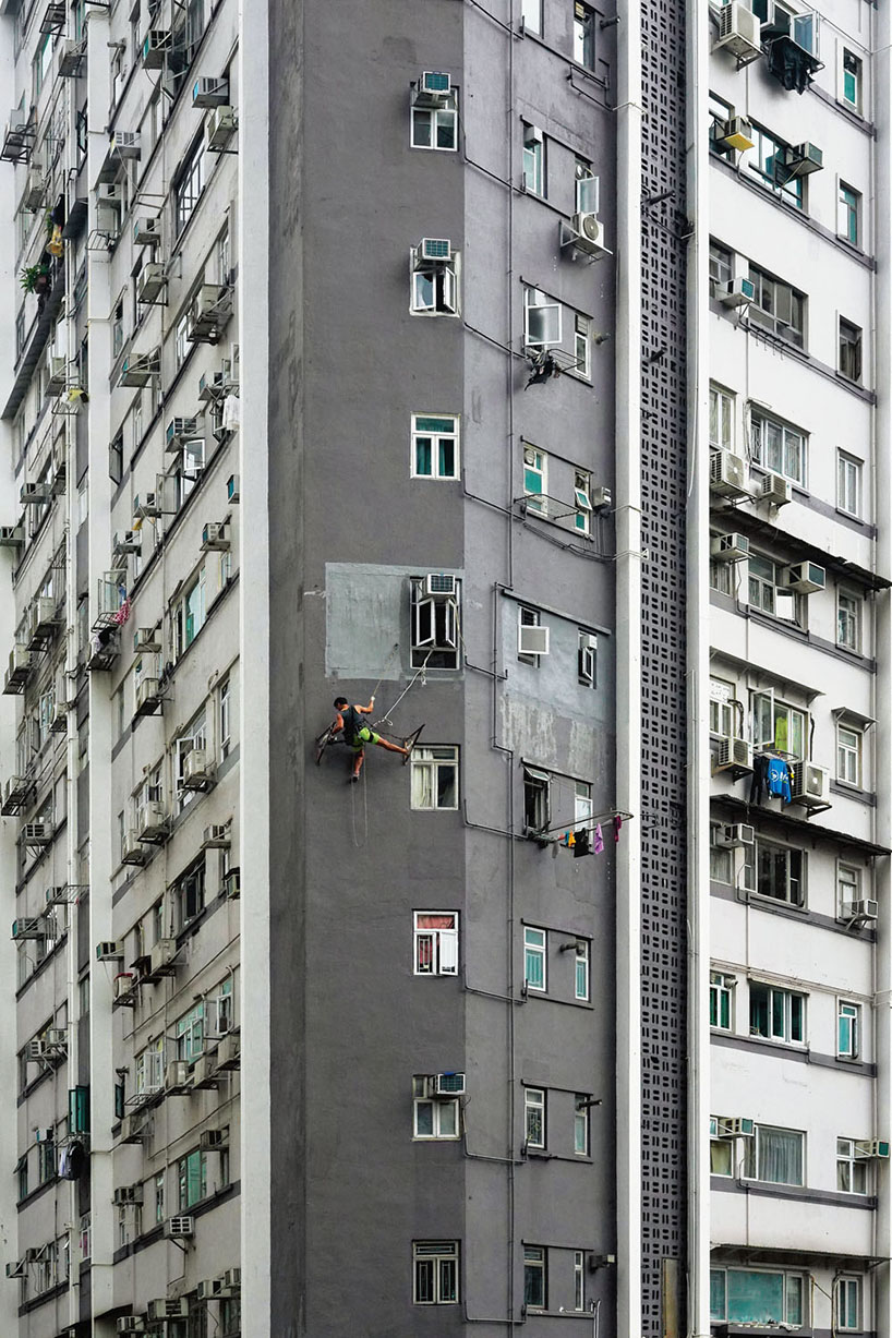 romain jacquet-lagrèze captures bamboo scaffolding workers hovering above hong kong