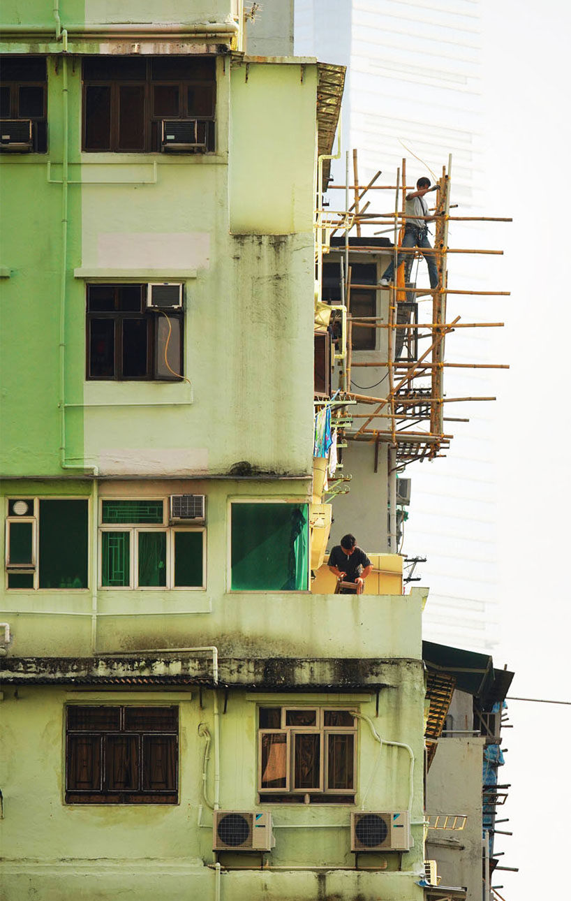 romain jacquet-lagrèze captures bamboo scaffolding workers hovering above hong kong