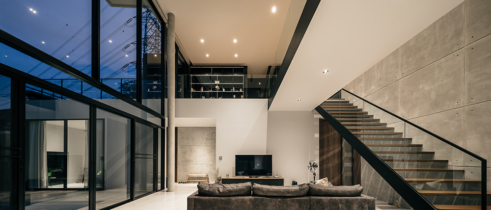 anonym studio combines wood, concrete and metal in a family residence in bangkok