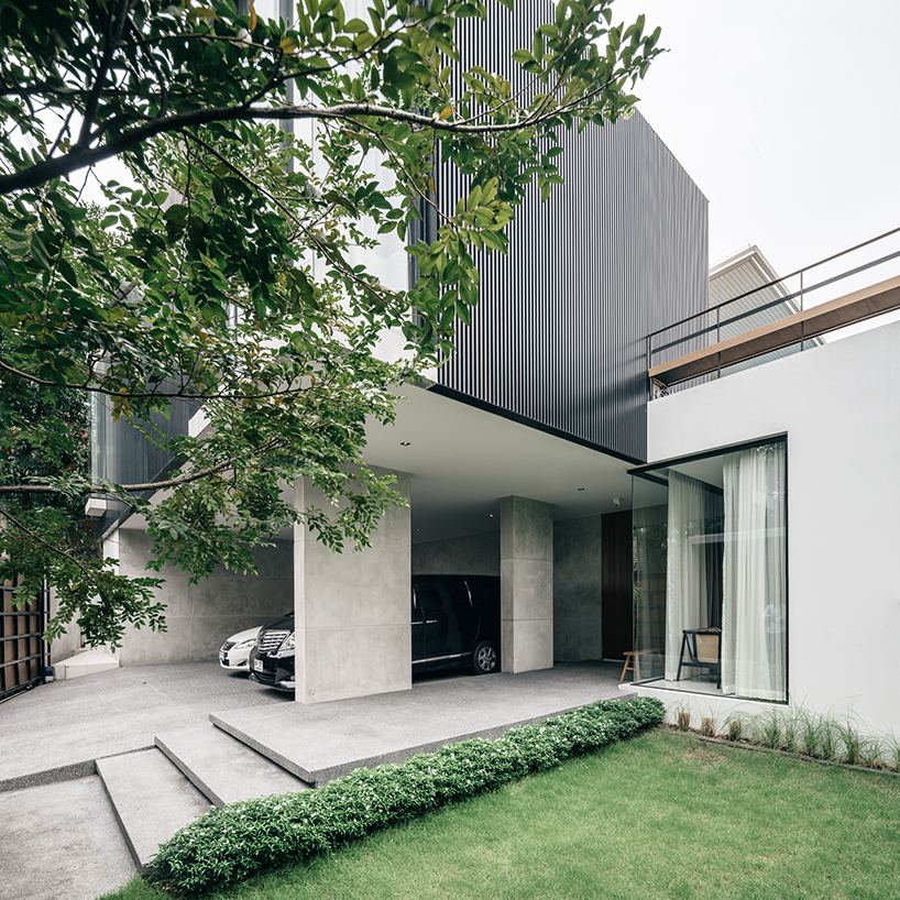 anonym studio combines wood, concrete and metal in a family residence in bangkok