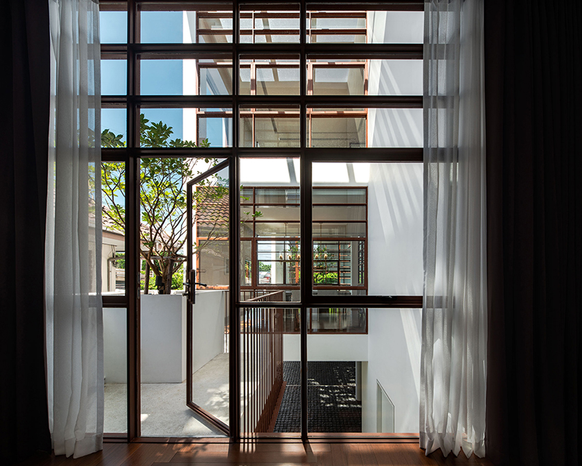 anonym studio merges indoor and outdoor space to create tree house in bangkok