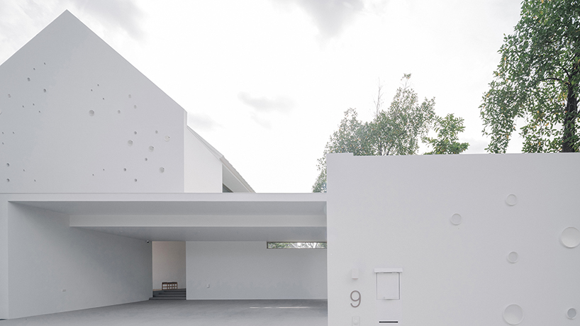 anonym studio's all-white house in bangkok adopts scandinavian minimalism